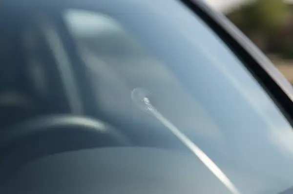 Sunlight reflecting through a repaired windshield chip